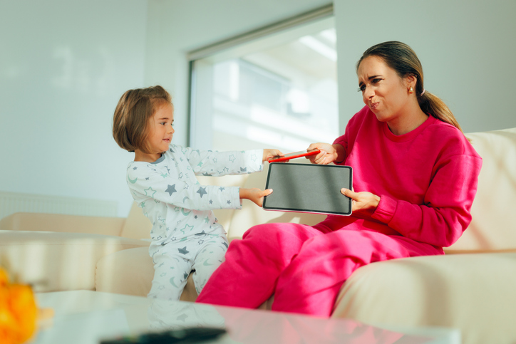Mother and Daughter Fighting over Technology Internet Overuse