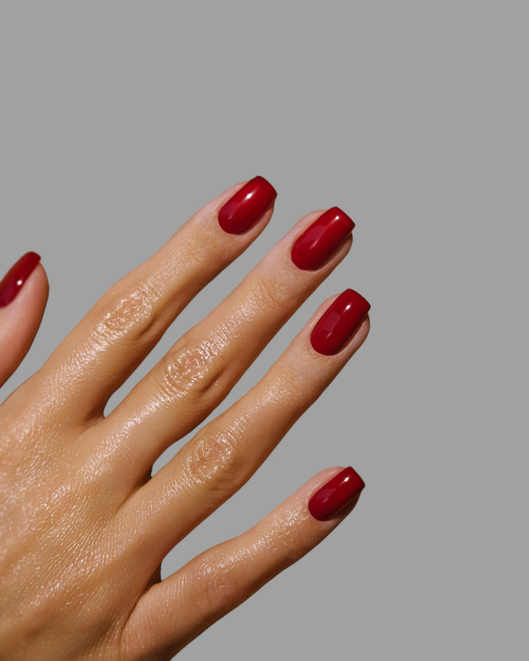 Beautiful young woman's hands with simple, modern and creative nail polish with light background _ Skin and nail care