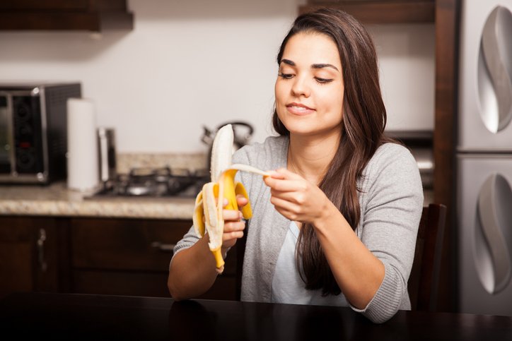 Peeling a banana in the kitchen