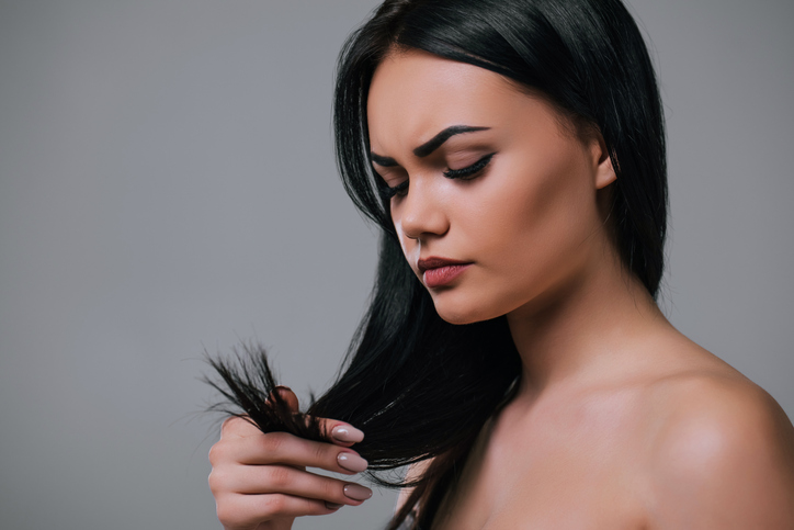 Beautiful woman on grey background.