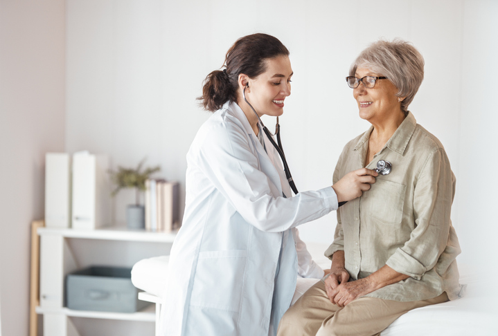 patient with a doctor in medical office