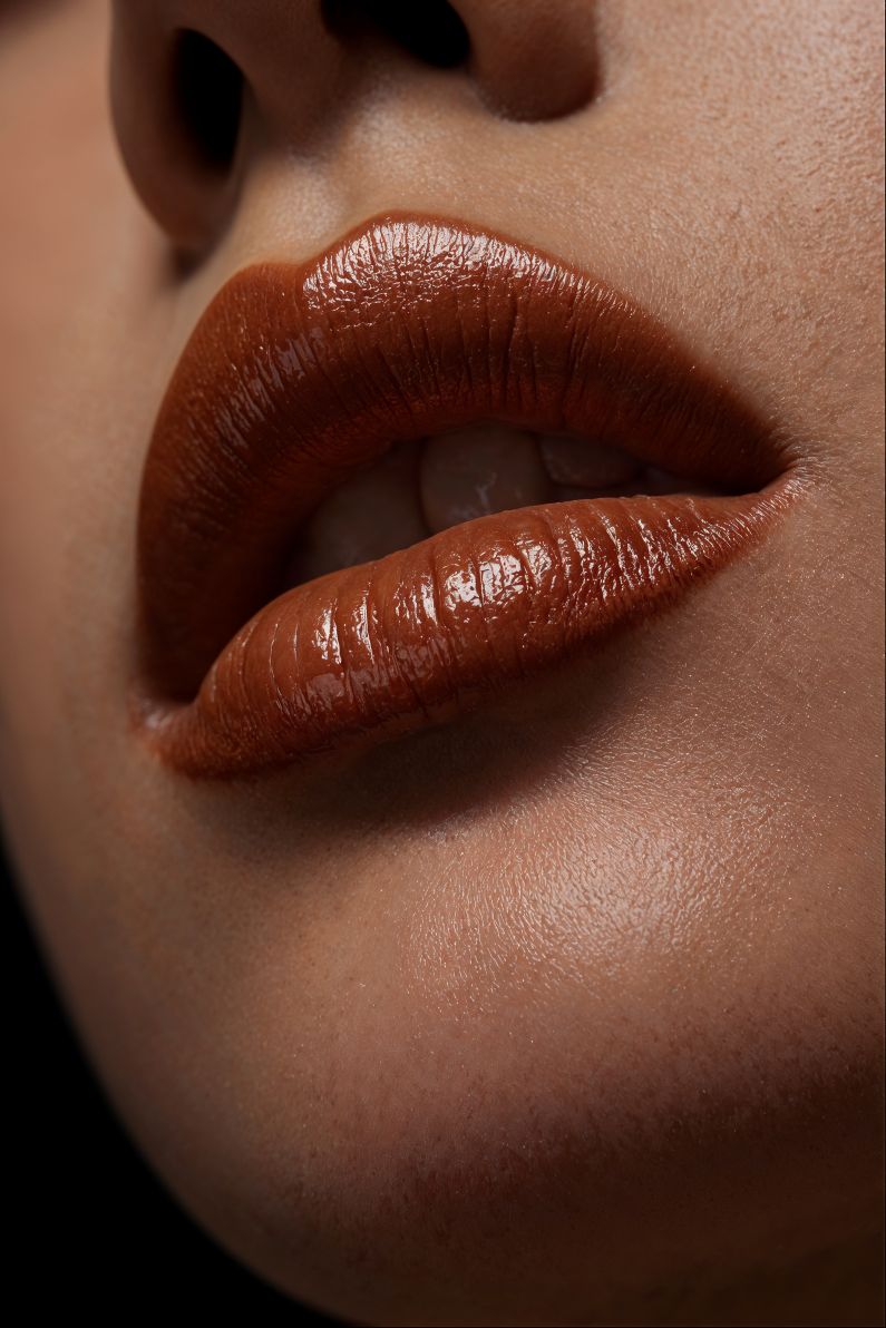 close up woman wearing brown makeup